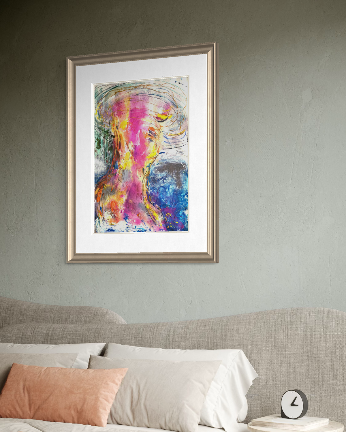 A framed abstract art with vibrant pink, purple, blue, and yellow brushstrokes, displayed on a textured gray wall above a bed with neutral-toned bedding and pillows.