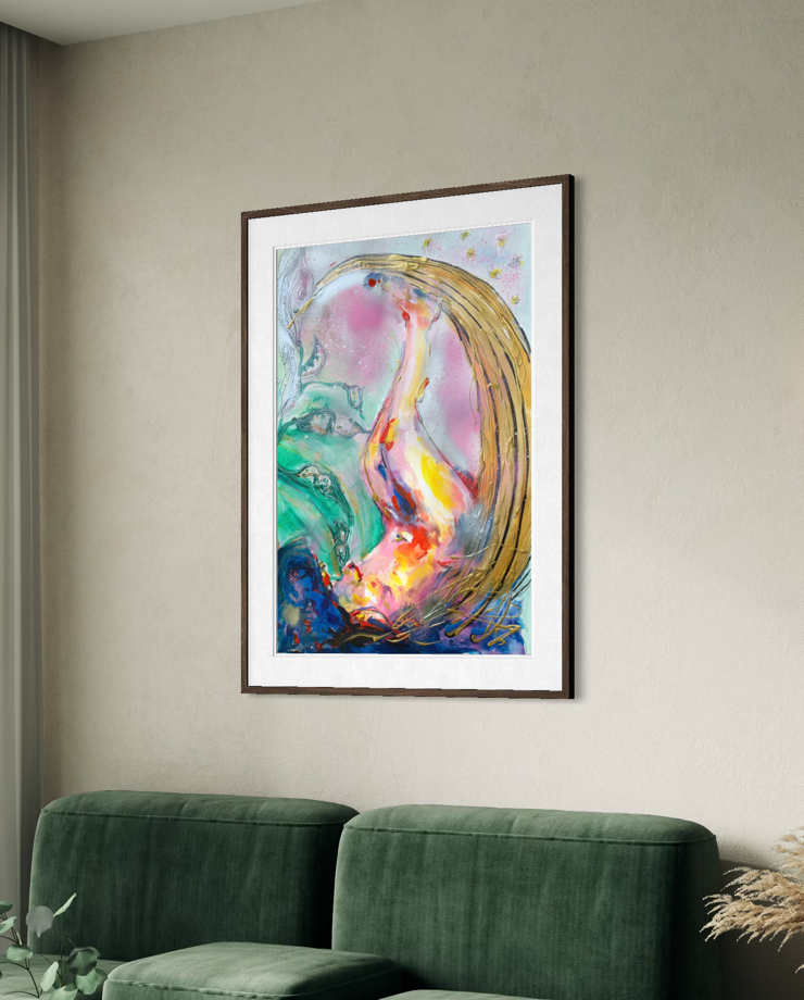 A framed abstract art print featuring a stylized pink and yellow bird-like figure with green and blue accents, displayed on a beige wall above a green sofa.