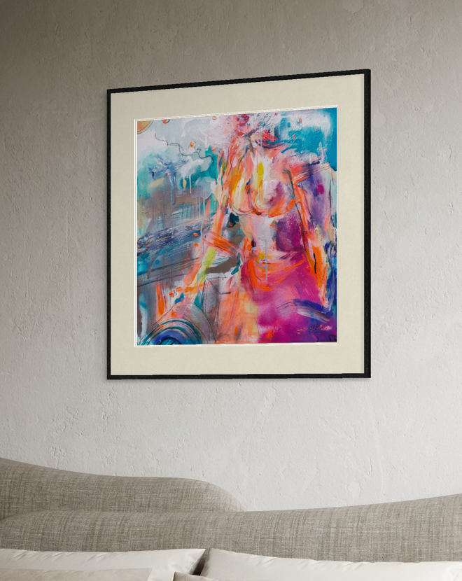 A framed abstract painting featuring a colorful female figure in a vibrant mix of pink, orange, blue, and purple tones, displayed on a textured light gray wall above a modern gray sofa.