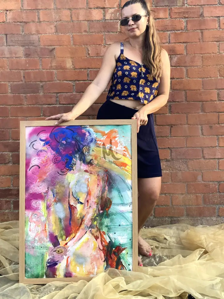 pretty woman is holding original abstract painting 