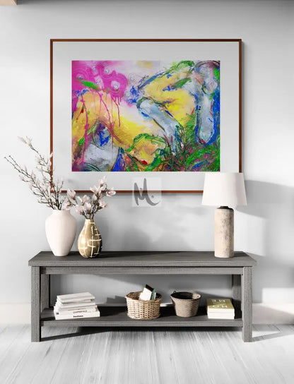 Colorful abstract painting above a wooden shelf with decorative items in a room.
