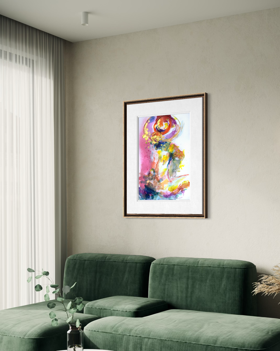 A framed abstract art print with vibrant multicolor brushstrokes hangs on a beige wall above a green sofa in a modern living room setting.