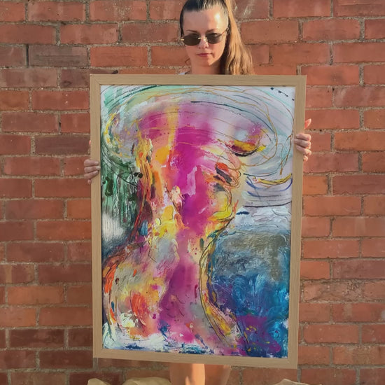 woman holding abstract woman painting art wall