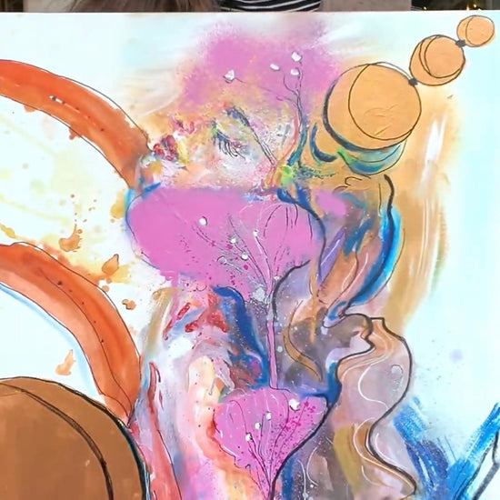 woman showing her abstract painting for sale