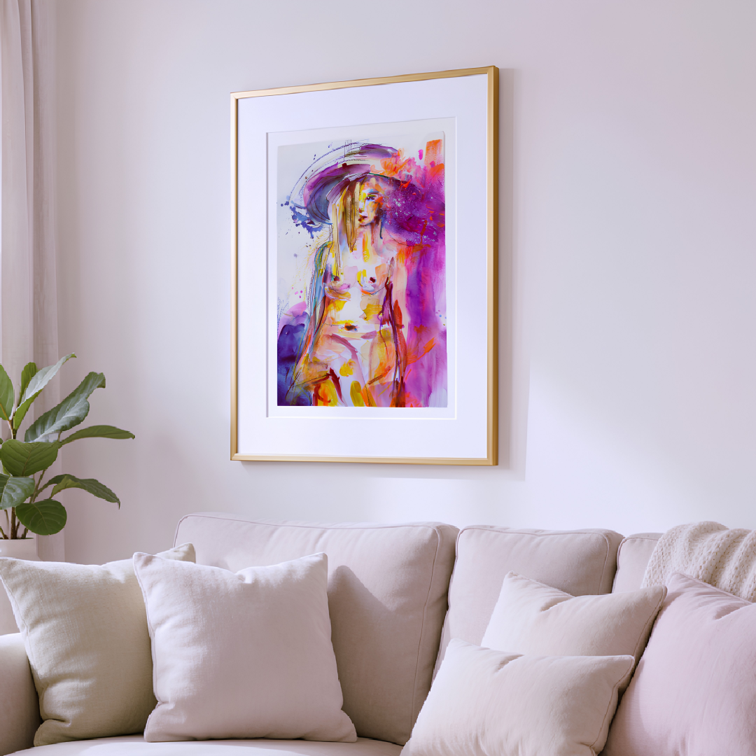 Framed abstract painting on a wall above a beige sofa with white cushions.